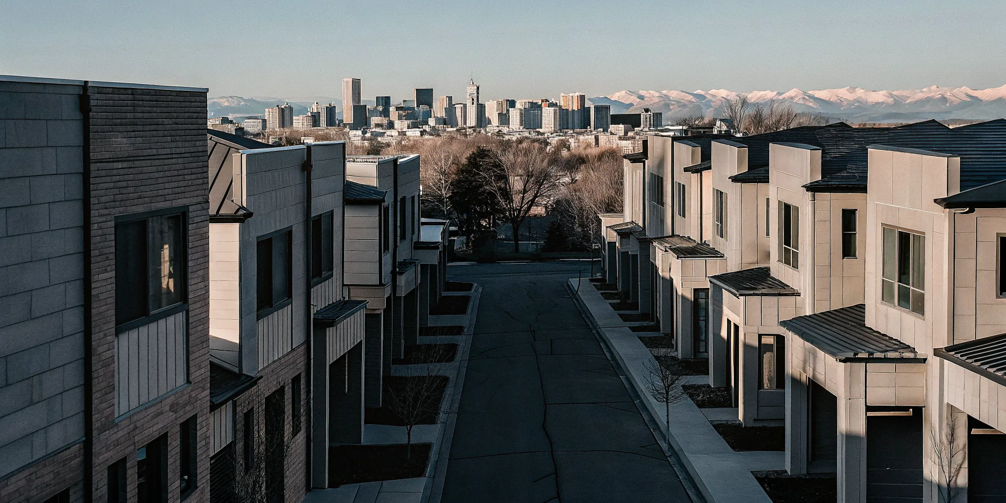 Modern sustainable homes in Denver built by top home builders with mountains in the background.