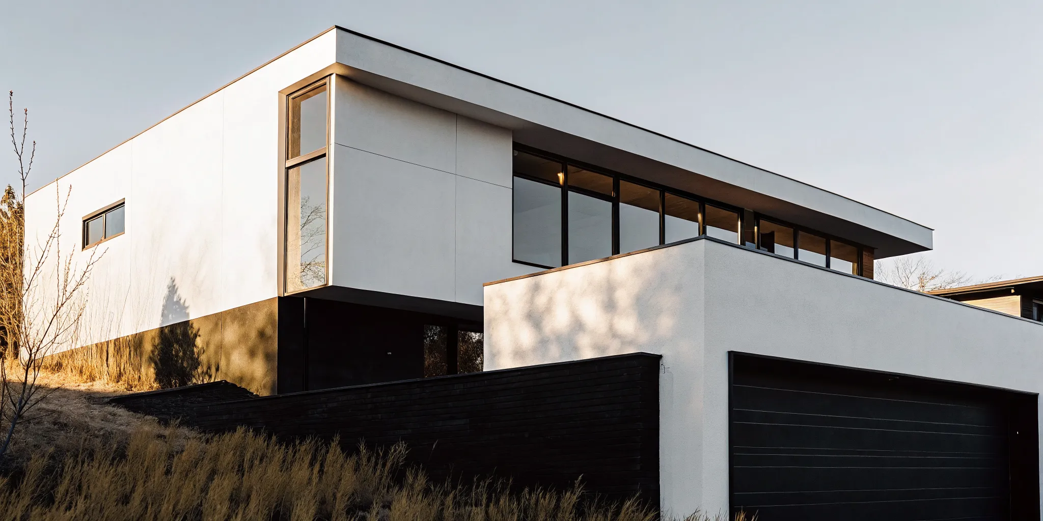 Modern custom home with large windows, built by expert home builders in Denver.