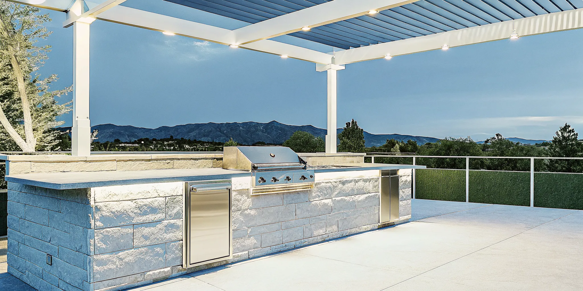 Modern outdoor kitchen in a Denver backyard with stone countertops and pergola