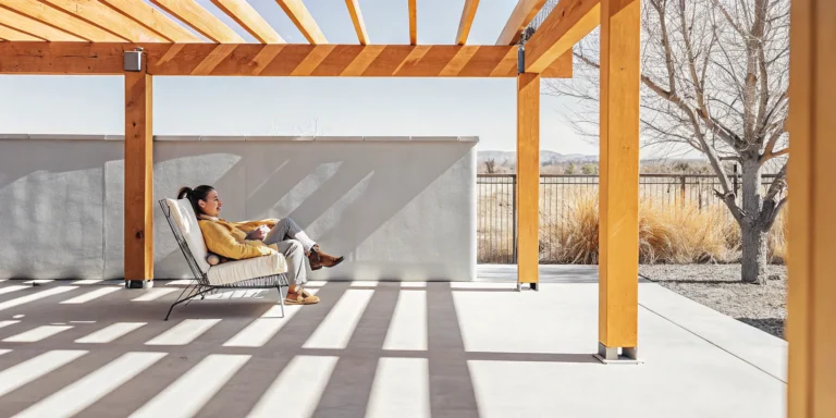 Covered patio and pergola shading a Denver backyard with outdoor seating