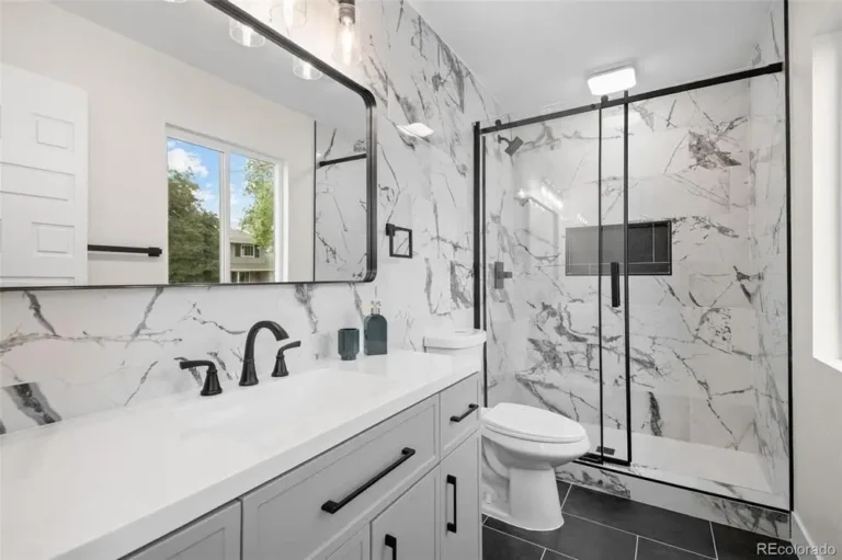 Completed bathroom remodel with a walk-in shower and vanity in a Denver Metro Area home