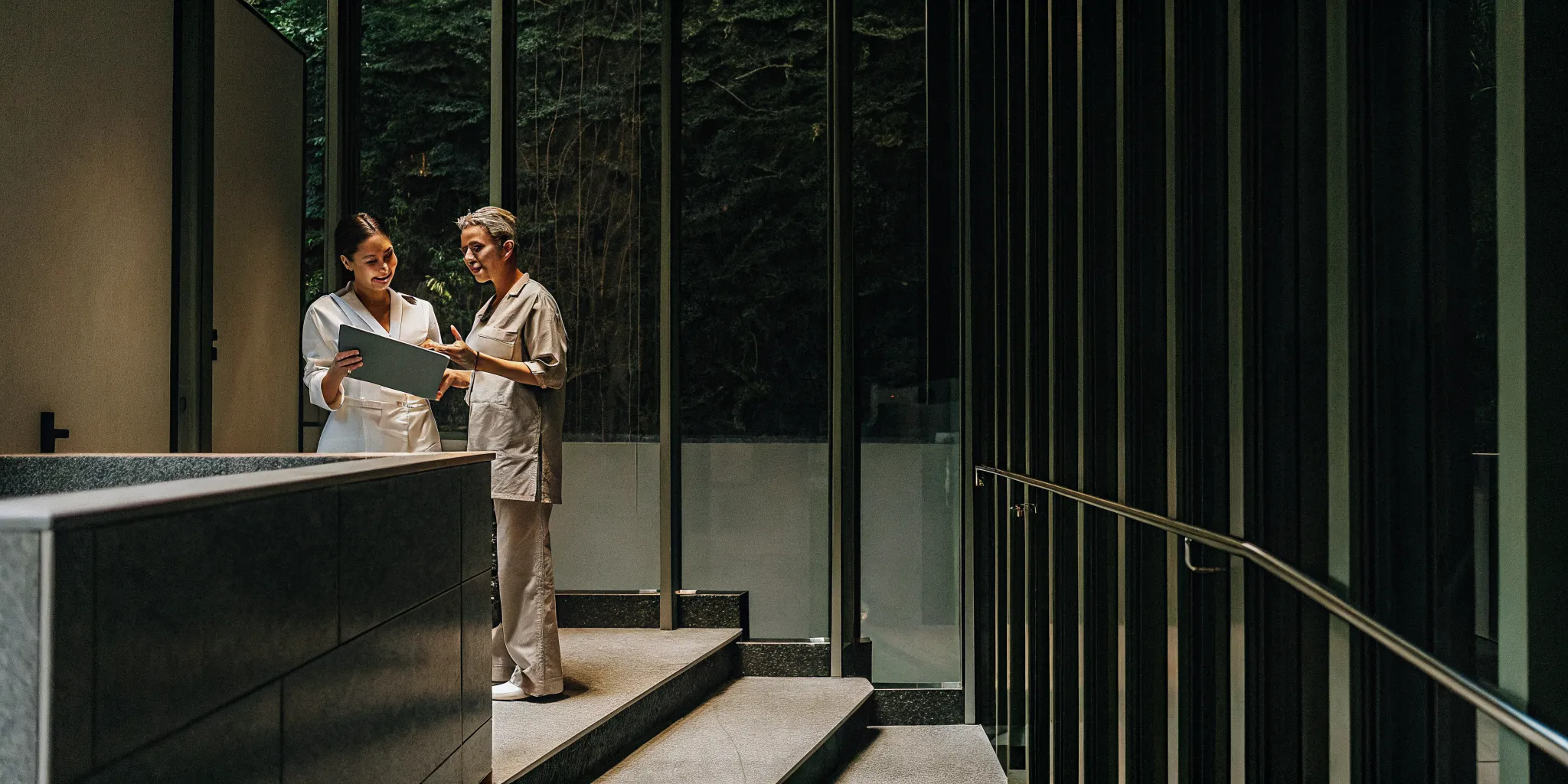 A commercial painting company discusses a project with a medical office manager.