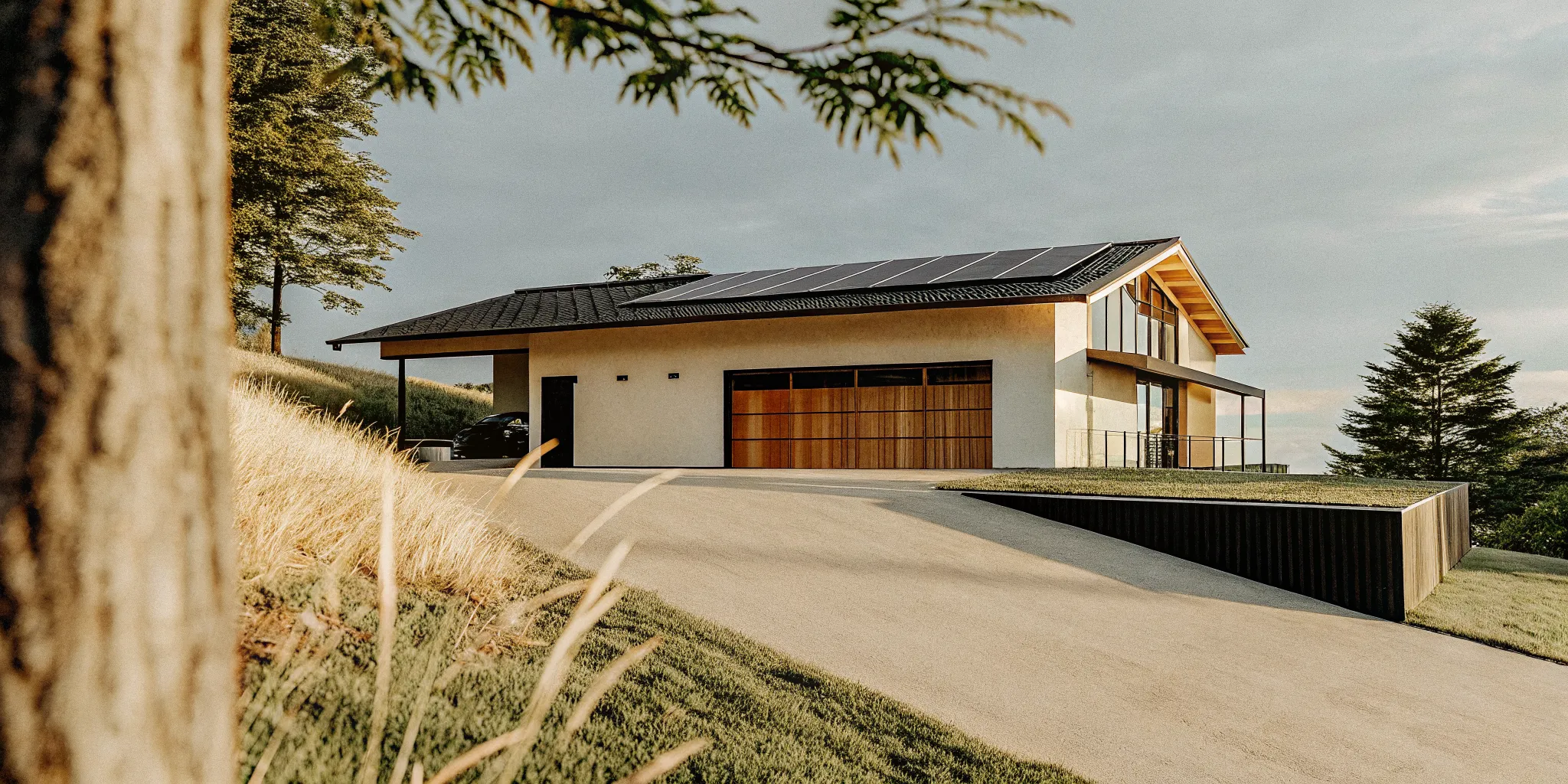 Modern sustainable estate home with solar panels and an energy-efficient design.