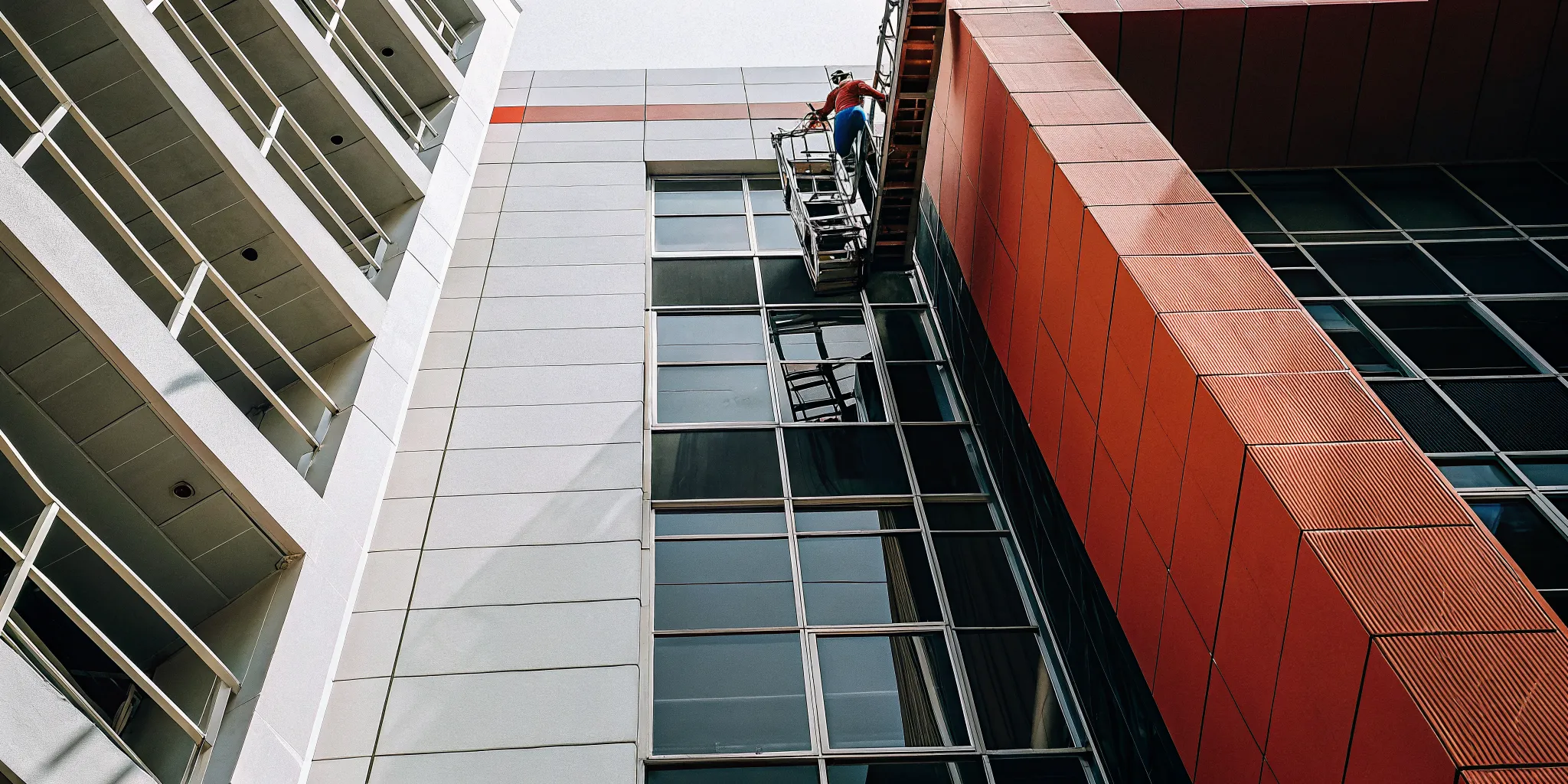 Commercial repainting specialists refreshing a property's exterior with a new coat of paint.